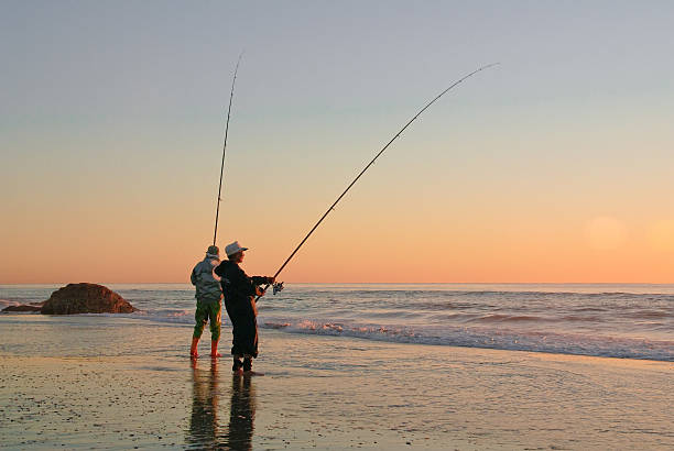 Fishing from the beach at dawn
